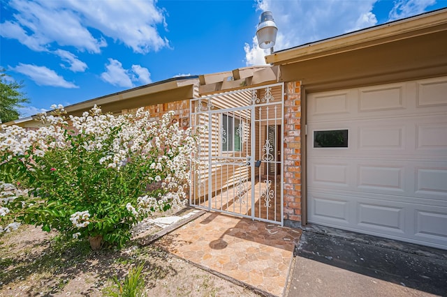 5615 Briarwood Forest Dr, Houston, TX 77088 - view of exterior entry featuring a garage and stone siding