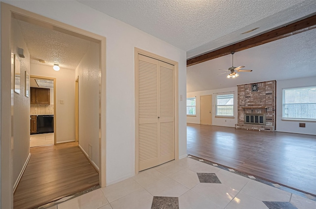 5615 Briarwood Forest Dr, Houston, TX 77088 - hall with a textured ceiling and light tile patterned floors