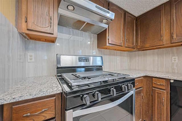 5615 Briarwood Forest Dr, Houston, TX 77088 - kitchen with black appliances, exhaust hood, tile patterned flooring, brown cabinetry, and light stone counters