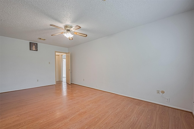 5615 Briarwood Forest Dr, Houston, TX 77088 - unfurnished room with ceiling fan, light wood-style floors, and a textured ceiling