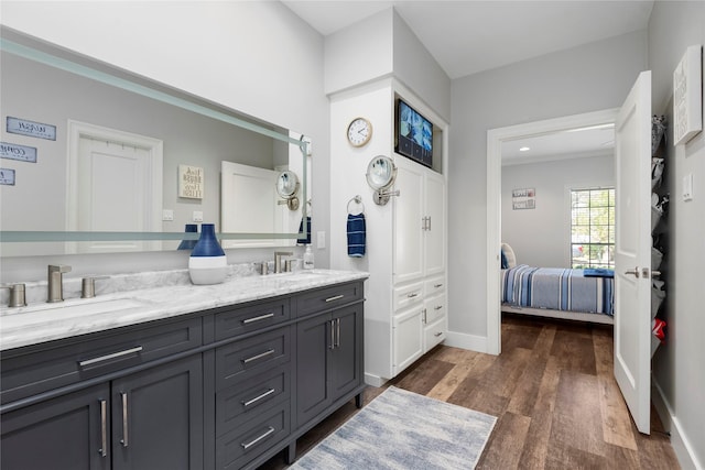 5411 Holly View Dr, Houston, TX 77091 - ensuite bathroom with double vanity and wood finished floors