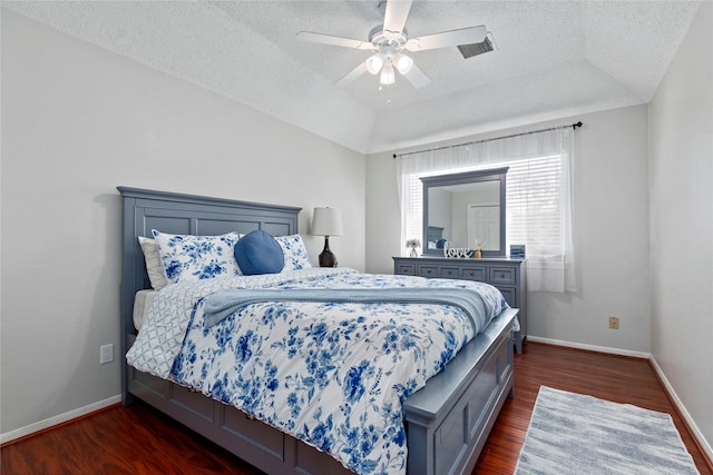 5411 Holly View Dr, Houston, TX 77091 - bedroom with dark wood-style floors, a textured ceiling, a ceiling fan, and lofted ceiling