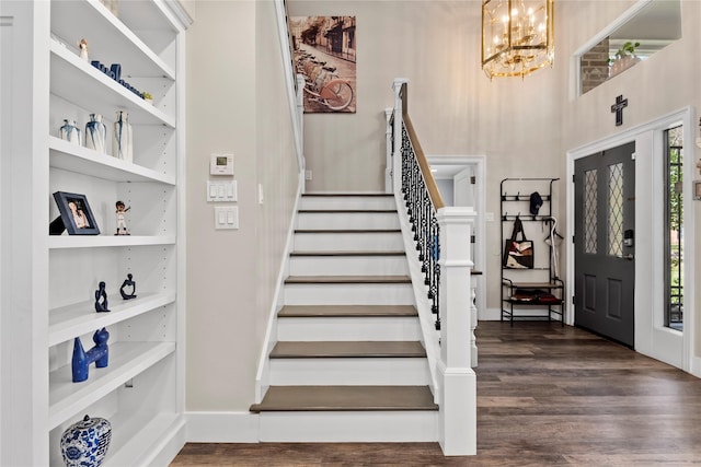 5411 Holly View Dr, Houston, TX 77091 - entrance foyer with a chandelier, dark wood-style flooring, and stairs