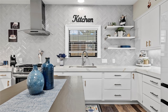 5411 Holly View Dr, Houston, TX 77091 - kitchen featuring wall chimney range hood, backsplash, and white cabinets