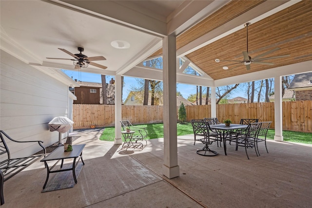5411 Holly View Dr, Houston, TX 77091 - fenced backyard featuring ceiling fan, outdoor dining area, a patio, and grilling area