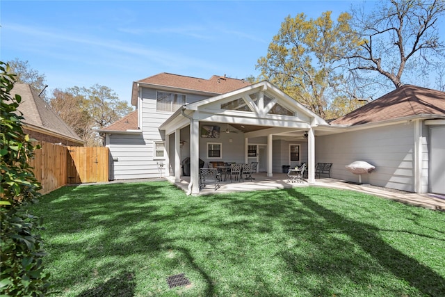 5411 Holly View Dr, Houston, TX 77091 - rear view of house featuring a ceiling fan, a patio area, and a gate