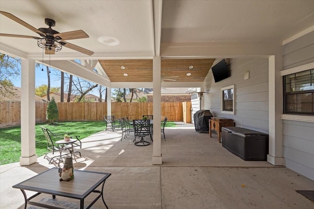 5411 Holly View Dr, Houston, TX 77091 - fenced backyard featuring outdoor dining space, a ceiling fan, a grill, and a patio area