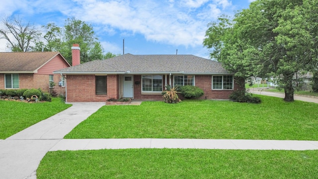 3111 Tanglebriar Dr, Pasadena, TX 77503 - single story home with a front lawn, brick siding, a chimney, driveway, and roof with shingles