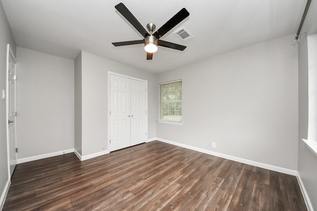 3111 Tanglebriar Dr, Pasadena, TX 77503 - unfurnished bedroom featuring dark wood-style floors, a closet, and a ceiling fan