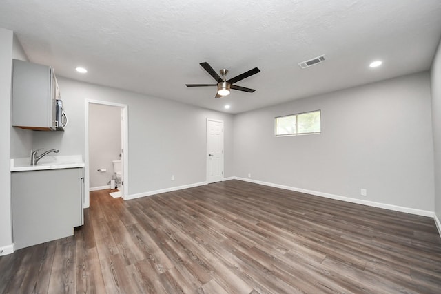 3111 Tanglebriar Dr, Pasadena, TX 77503 - unfurnished living room featuring a ceiling fan, recessed lighting, and dark wood-style flooring