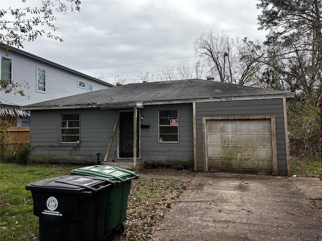 5326 Wenda St, Houston, TX 77033 - view of front of house with concrete driveway and a garage