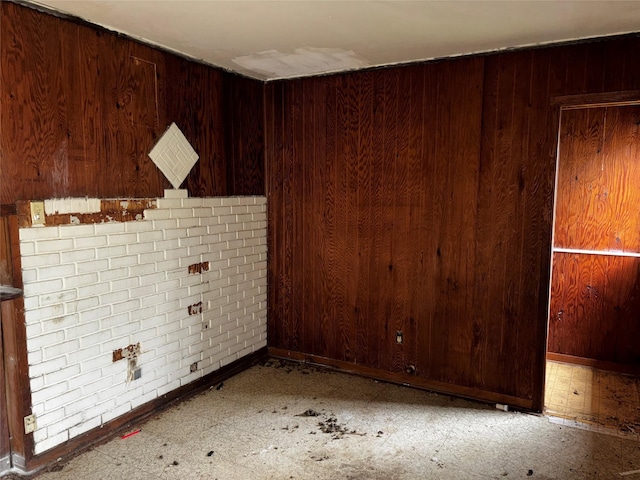 5326 Wenda St, Houston, TX 77033 - spare room featuring wood walls and baseboards