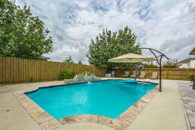 9910 Tulip, Conroe, TX 77385 - view of swimming pool featuring a fenced backyard and a patio