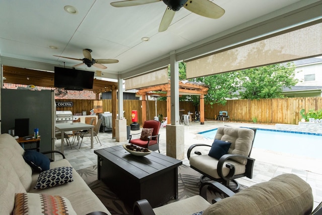 9910 Tulip, Conroe, TX 77385 - fenced backyard with ceiling fan, an outdoor hangout area, outdoor dining area, a patio, and area for grilling