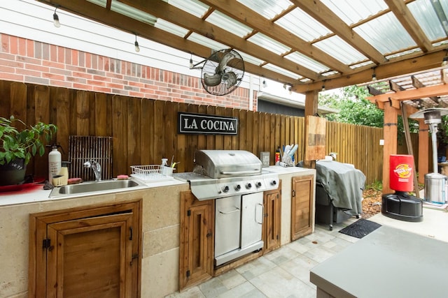 9910 Tulip, Conroe, TX 77385 - view of patio with area for grilling and a pergola