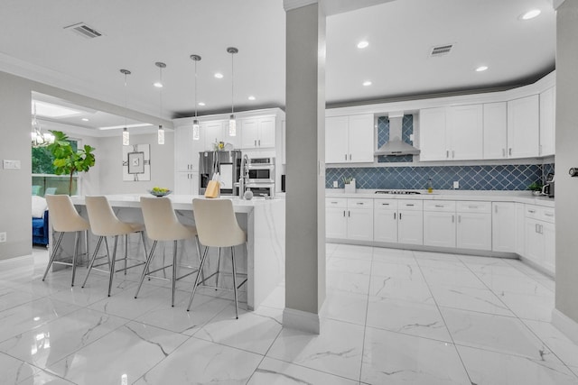9910 Tulip, Conroe, TX 77385 - kitchen featuring wall chimney exhaust hood, stainless steel appliances, light marble finish floors, recessed lighting, and light countertops