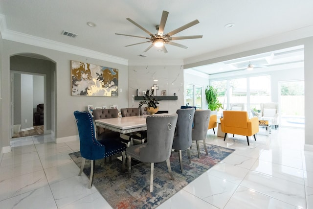 9910 Tulip, Conroe, TX 77385 - dining room featuring a ceiling fan, crown molding, arched walkways, light marble finish floors, and recessed lighting