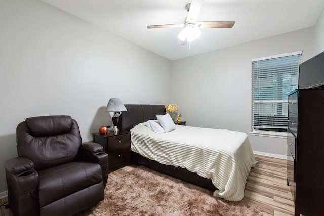 9910 Tulip, Conroe, TX 77385 - bedroom with wood finished floors and ceiling fan