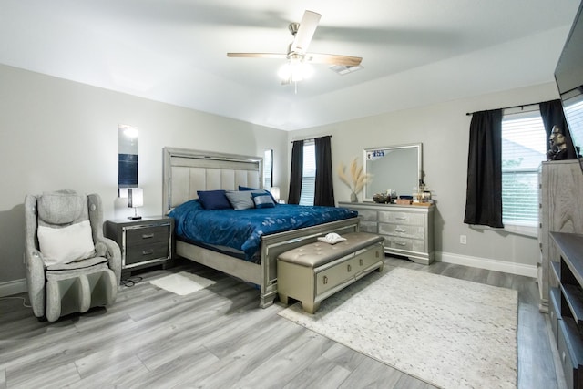 9910 Tulip, Conroe, TX 77385 - bedroom featuring wood finished floors and ceiling fan