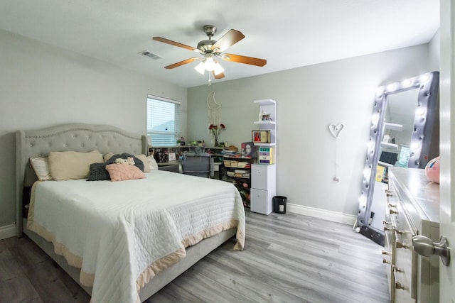9910 Tulip, Conroe, TX 77385 - bedroom with light wood finished floors and a ceiling fan