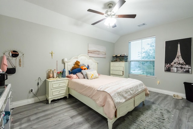 9910 Tulip, Conroe, TX 77385 - bedroom featuring wood finished floors, lofted ceiling, and ceiling fan