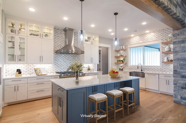 4410 Jozwiak Rd, Chappell Hill, TX 77426 - kitchen with wall chimney range hood, open shelves, a kitchen island, white cabinets, and recessed lighting