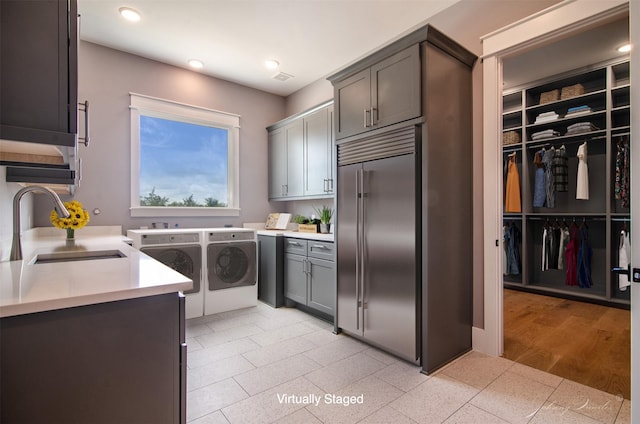 4410 Jozwiak Rd, Chappell Hill, TX 77426 - kitchen with stainless steel built in refrigerator, washer and clothes dryer, light countertops, and recessed lighting
