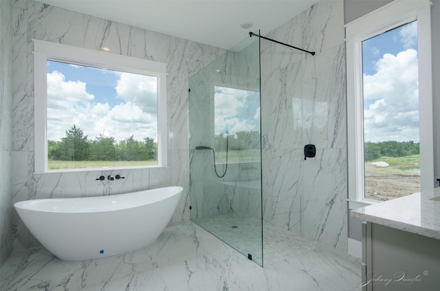 4410 Jozwiak Rd, Chappell Hill, TX 77426 - bathroom with a freestanding bath, a marble finish shower, vanity, and marble tiled floors