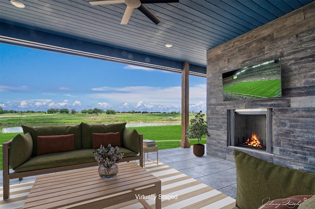 4410 Jozwiak Rd, Chappell Hill, TX 77426 - view of patio with an outdoor stone fireplace, a water view, and ceiling fan