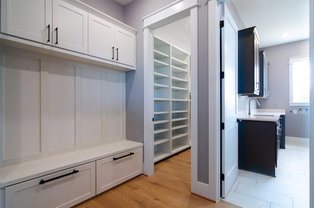 4410 Jozwiak Rd, Chappell Hill, TX 77426 - mudroom featuring a sink and light wood finished floors