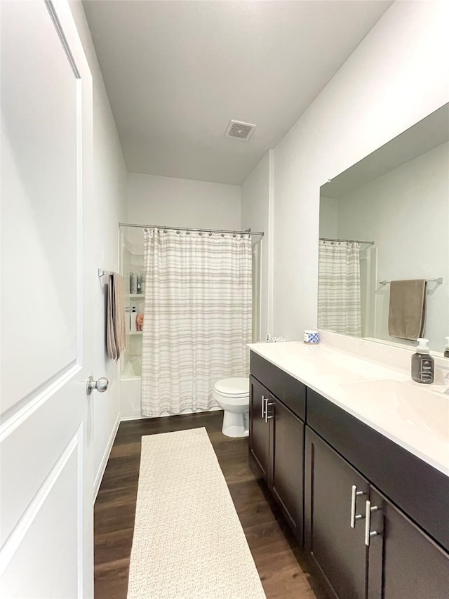 5835 Finely Run St, Spring, TX 77373 - bathroom with vanity, wood finished floors, and shower / bath combo with shower curtain