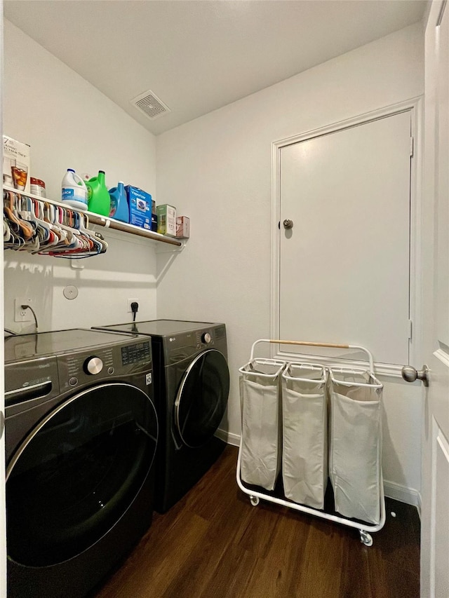 5835 Finely Run St, Spring, TX 77373 - laundry area featuring separate washer and dryer and dark wood-type flooring
