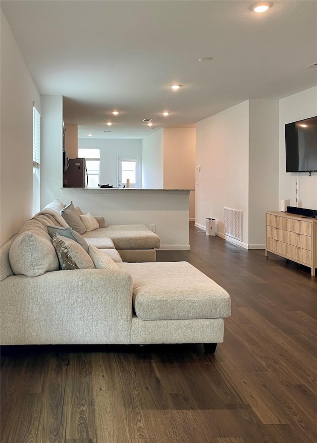 5835 Finely Run St, Spring, TX 77373 - living room with dark wood-style flooring and recessed lighting