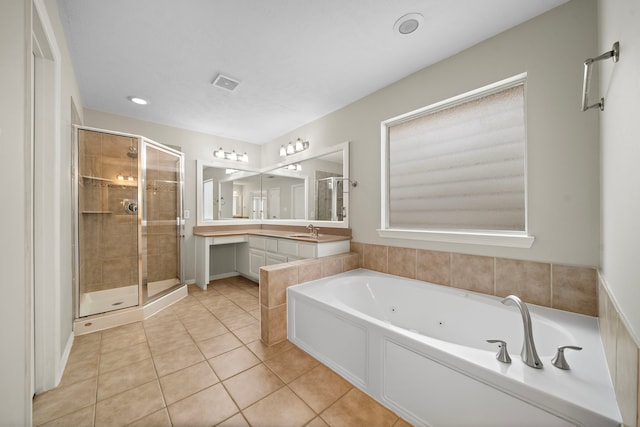1517 Asbury St, Houston, TX 77007 - bathroom with a tub with jets, a stall shower, tile patterned floors, vanity, and recessed lighting