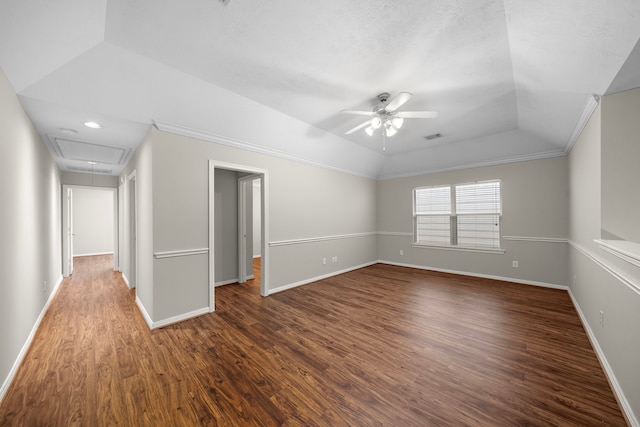 1517 Asbury St, Houston, TX 77007 - spare room featuring a ceiling fan, attic access, dark wood-type flooring, a tray ceiling, and vaulted ceiling
