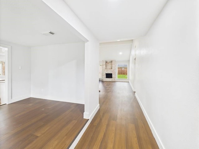 8918 Bold Forest Dr, Houston, TX 77088 - corridor featuring baseboards and dark wood-style floors