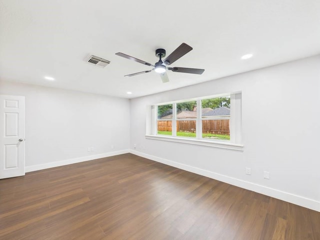 8918 Bold Forest Dr, Houston, TX 77088 - unfurnished room with dark wood-style flooring, a ceiling fan, and recessed lighting