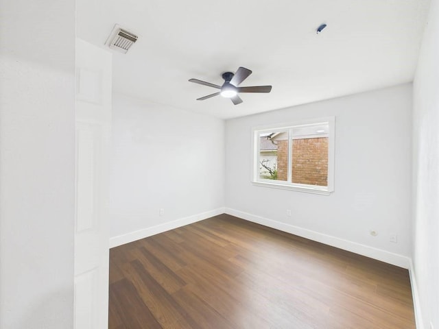 8918 Bold Forest Dr, Houston, TX 77088 - unfurnished room with dark wood-style flooring and ceiling fan