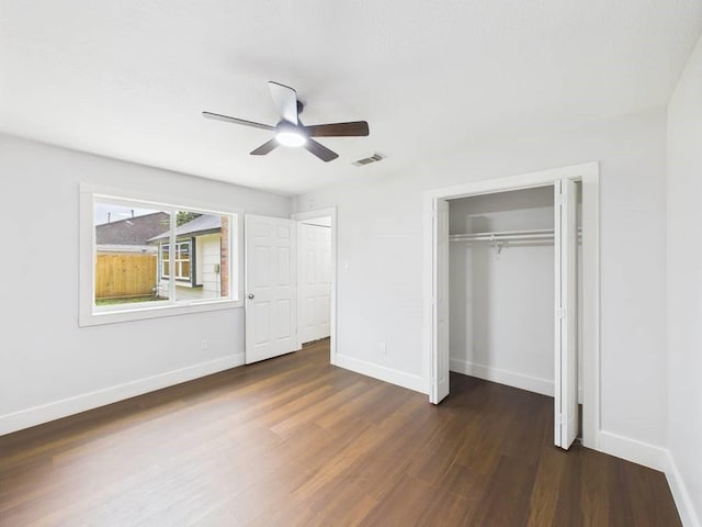 8918 Bold Forest Dr, Houston, TX 77088 - unfurnished bedroom with dark wood-style floors, a closet, and a ceiling fan