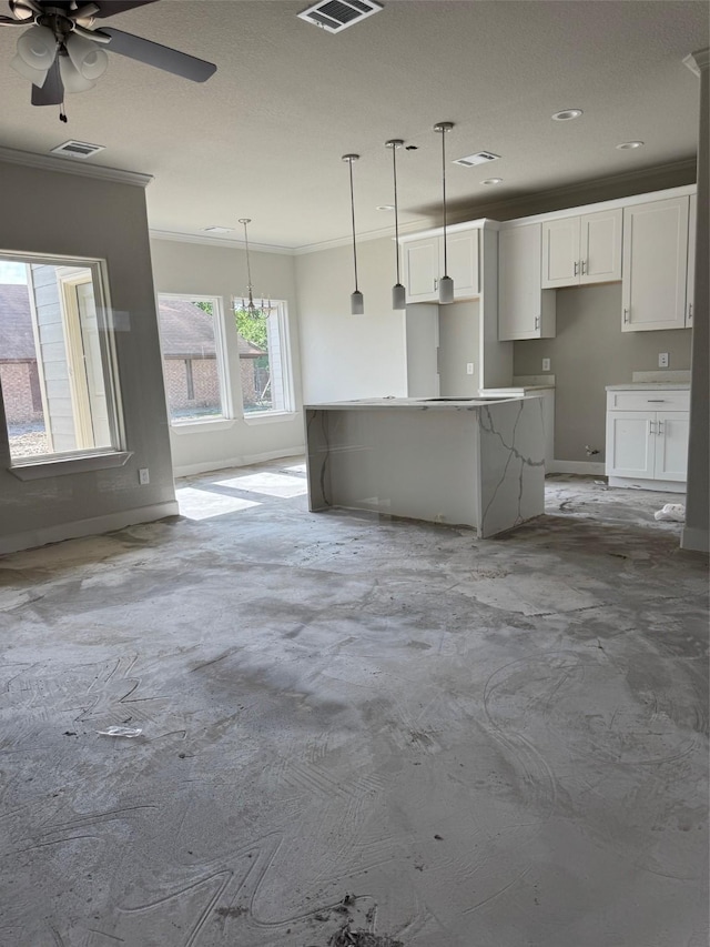 5503 Bacher St, Houston, TX 77028 - kitchen with ornamental molding, white cabinets, a ceiling fan, hanging light fixtures, and a kitchen island