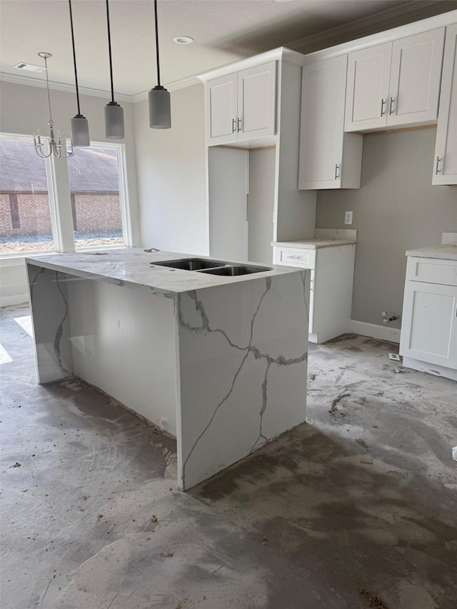 5503 Bacher St, Houston, TX 77028 - kitchen with white cabinetry, a kitchen island, light stone countertops, ornamental molding, and pendant lighting