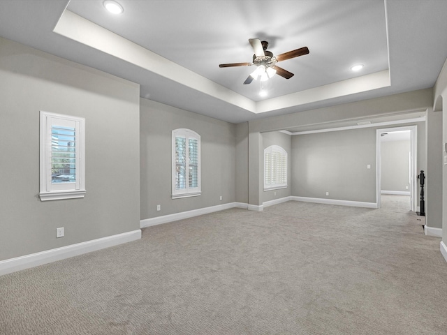11913 Barryknoll Ln, Houston, TX 77024 - carpeted spare room featuring a tray ceiling, ceiling fan, and recessed lighting