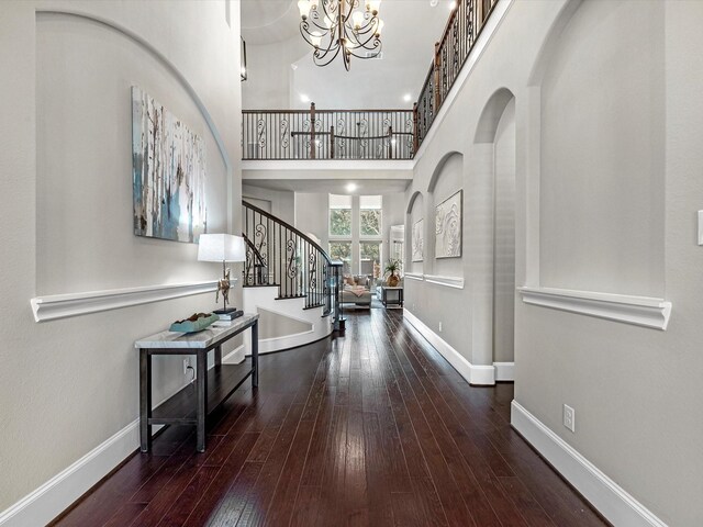 11913 Barryknoll Ln, Houston, TX 77024 - entryway featuring stairway, hardwood / wood-style floors, a chandelier, and a towering ceiling