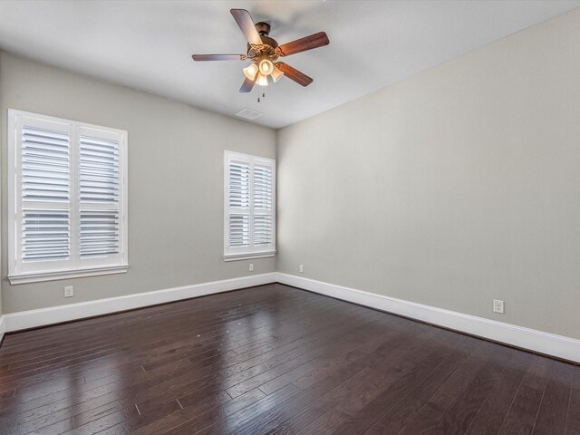 11913 Barryknoll Ln, Houston, TX 77024 - empty room featuring ceiling fan and dark wood-style flooring