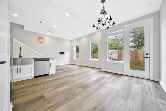 6727 Parker Oaks Ln, Houston, TX 77076 - unfurnished living room with a chandelier, light wood-type flooring, and recessed lighting