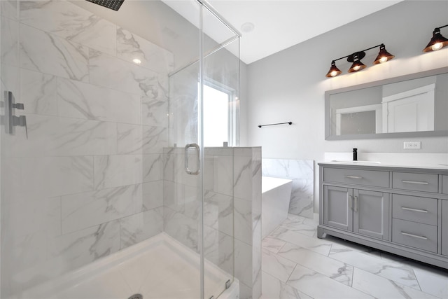 6727 Parker Oaks Ln, Houston, TX 77076 - full bathroom featuring a marble finish shower, vanity, a bathtub, and marble look tile flooring