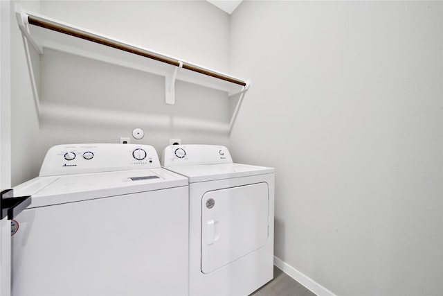 6727 Parker Oaks Ln, Houston, TX 77076 - laundry room featuring washer and dryer and wood finished floors