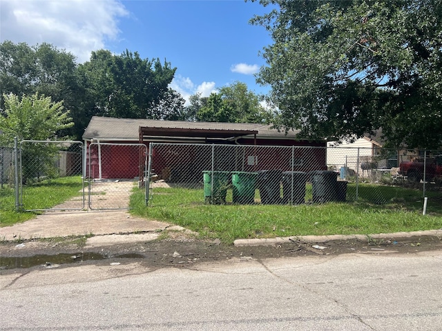 5719 Southwind St, Houston, TX 77033 - exterior space with a gate and an attached carport