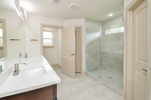 14835 Charlmont Dr, Houston, TX 77083 - bathroom with plenty of natural light, a stall shower, and double vanity