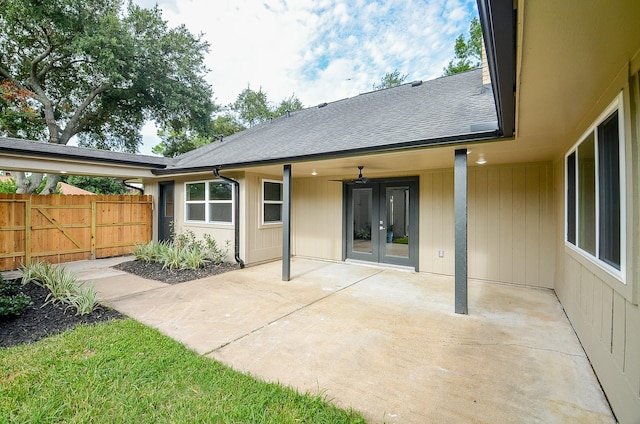 14835 Charlmont Dr, Houston, TX 77083 - back of house featuring french doors, a patio, roof with shingles, and a gate